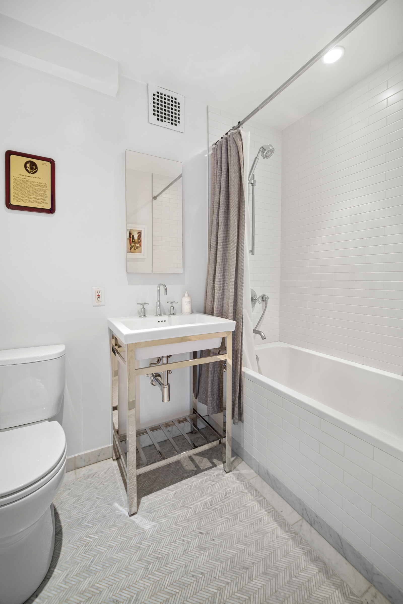 158 East 22nd Street, Unit 4 Manhattan, NY 10010 - Photo 13 of 15 a bathroom with a sink toilet and a bathtub