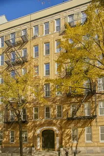 a group of people walking down a street