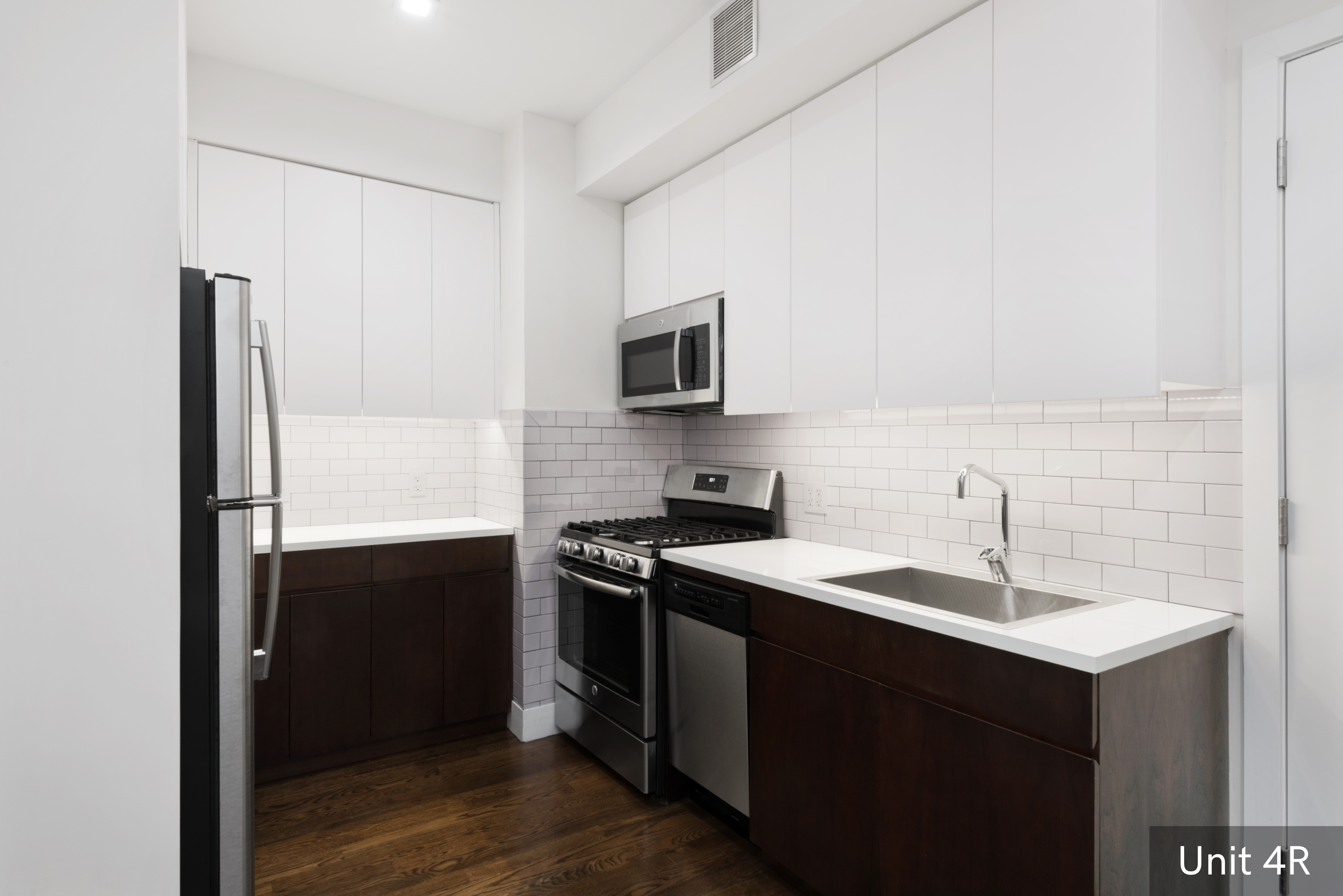 120 East 19th Street Manhattan, NY 10003 - Photo 26 of 33 a kitchen with a sink and a refrigerator