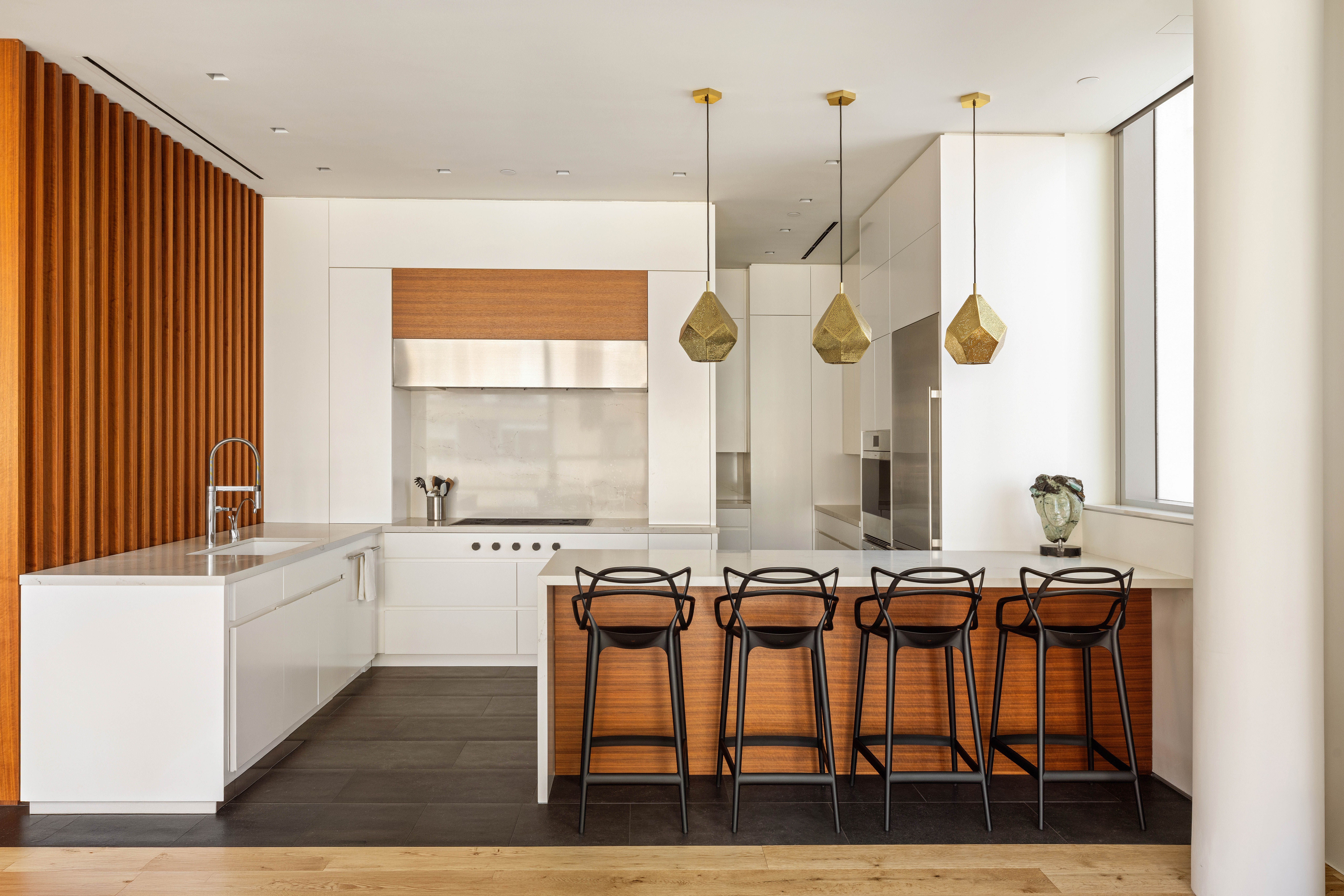 166 Perry Street, Unit 5A Manhattan, NY 10014 - Photo 8 of 25 a kitchen with a table chairs and windows