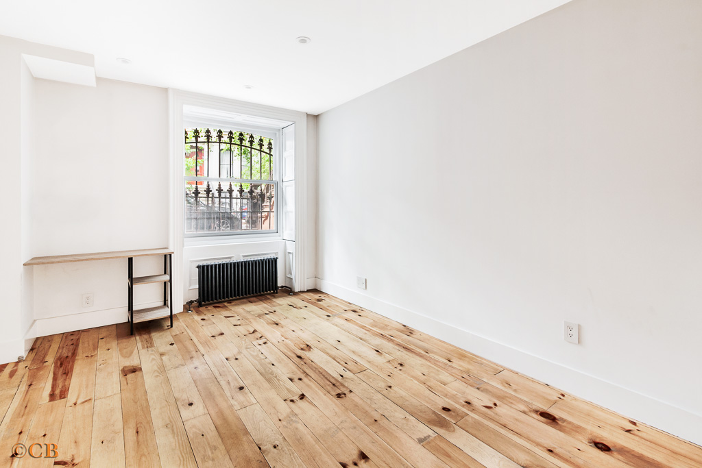 115 Lincoln Place, Unit 1 Brooklyn, NY 11217 - Photo 3 of 6 a view of a bedroom with wooden floor and a window