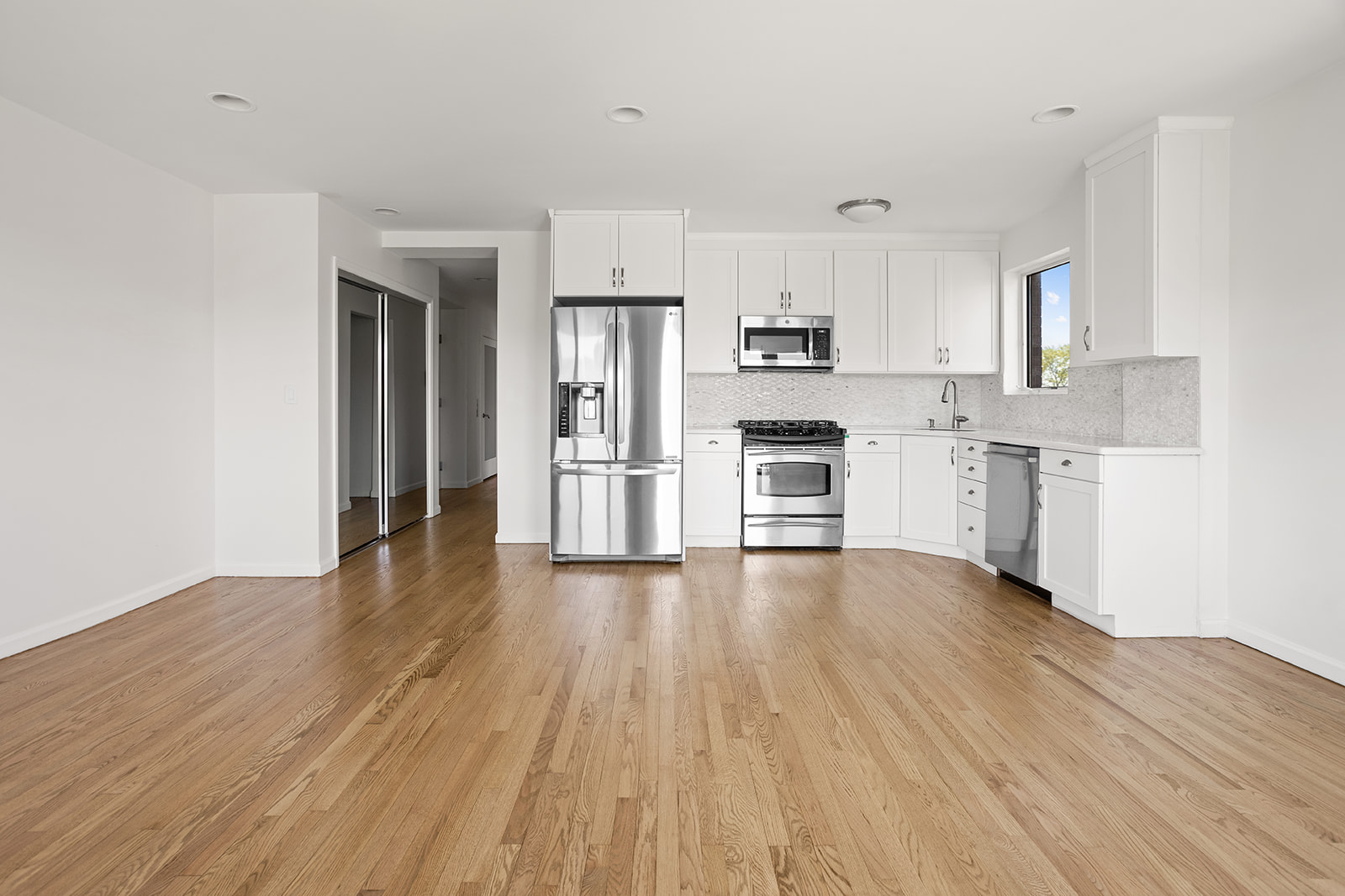 702 Ocean Parkway, Unit 5R Brooklyn, NY 11230 - Photo 3 of 13 a view of kitchen with wooden floor and electronic appliances