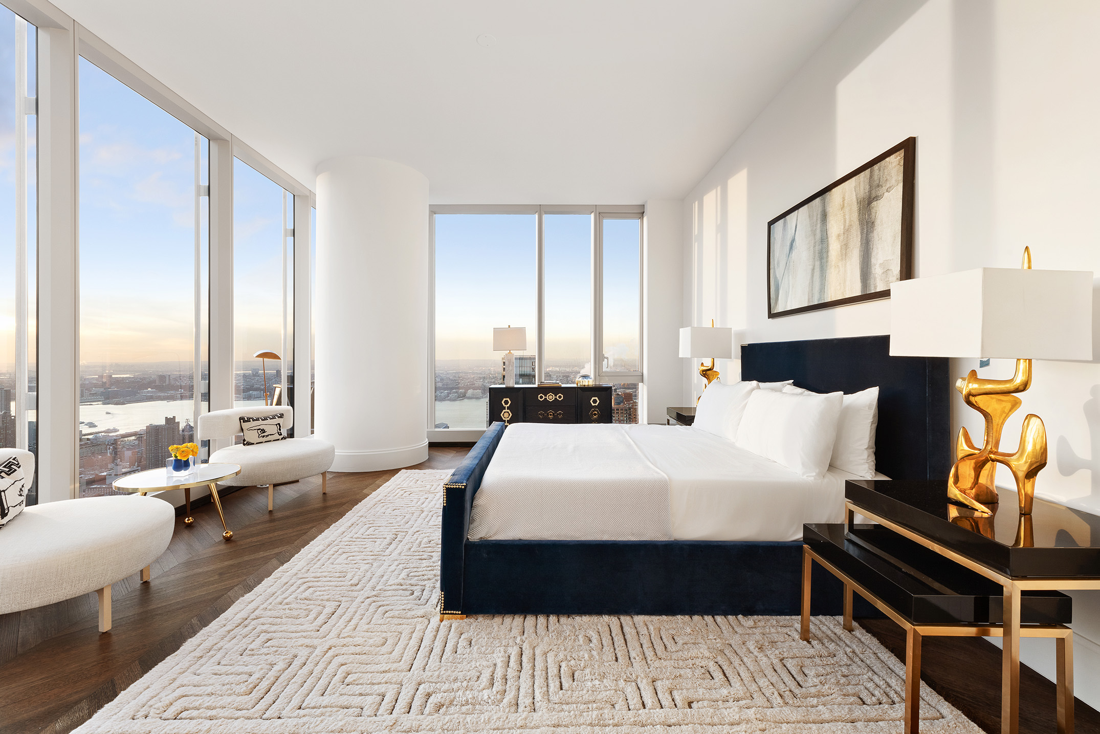 217 West 57th Street, Unit 60W Manhattan, NY 10019 - Photo 6 of 27 a large bedroom with a bed and wooden floor