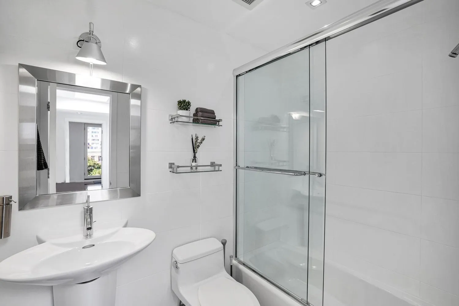 a view of a patio with table and chairs and wooden floor