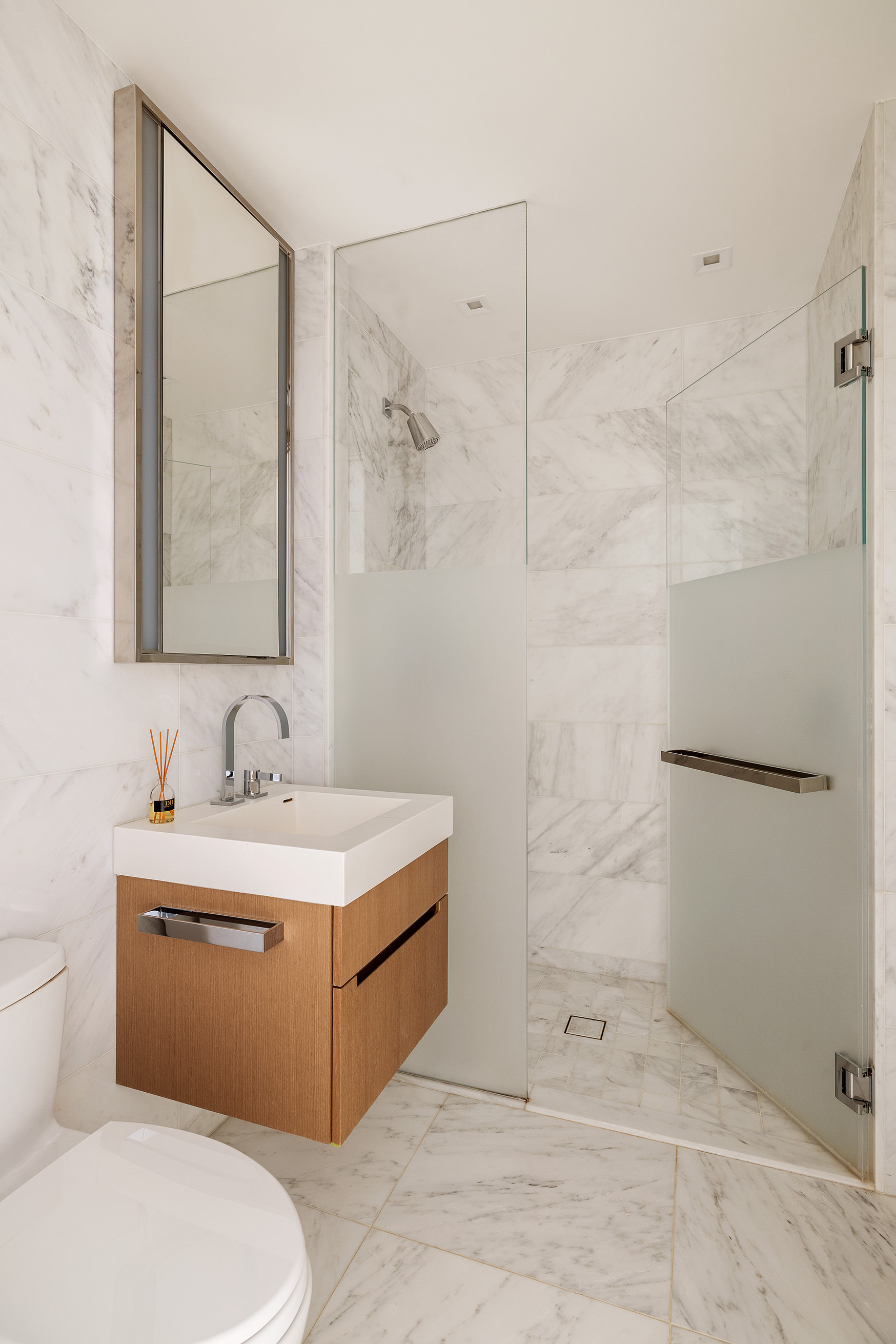 1 West End Avenue, Unit 25F Manhattan, NY 10023 - Photo 13 of 15 a bathroom with a sink a toilet and shower