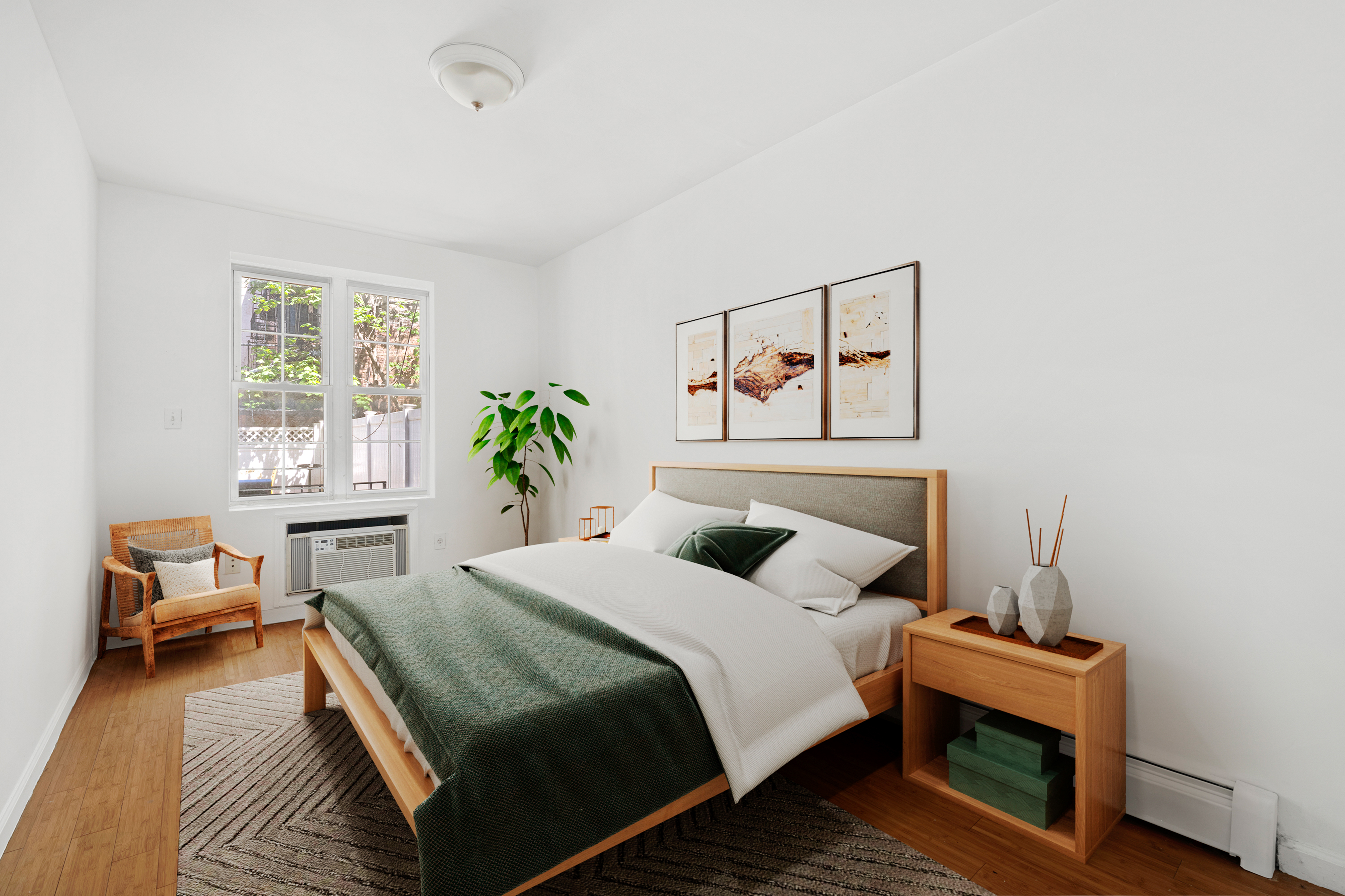 545 Gates Avenue, Unit 1 Brooklyn, NY 11216 - Photo 7 of 10 a bedroom with a bed and wooden floor