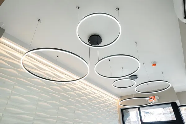 a view of a room with wooden floor and white walls