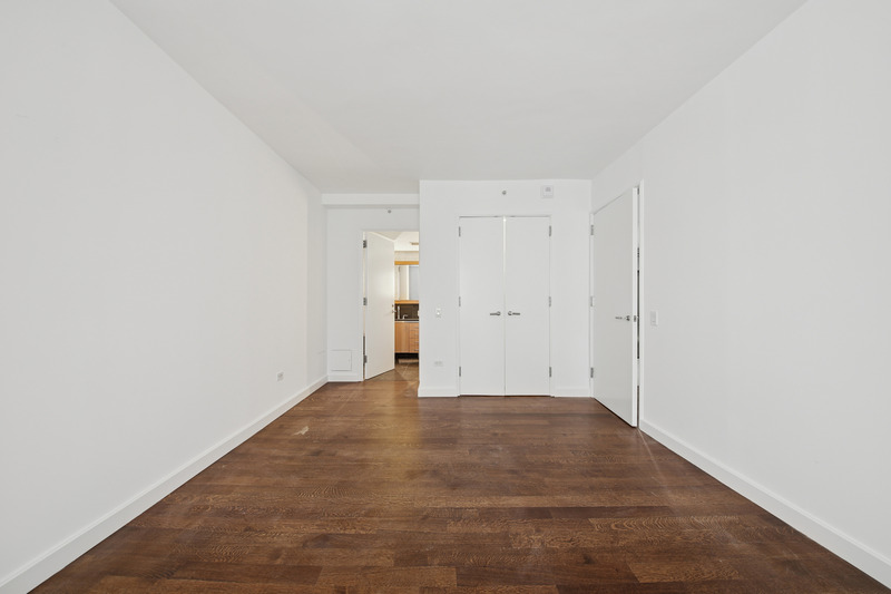 100 West 58th Street, Unit 5E Manhattan, NY 10019 - Photo 5 of 12 a view of an empty room