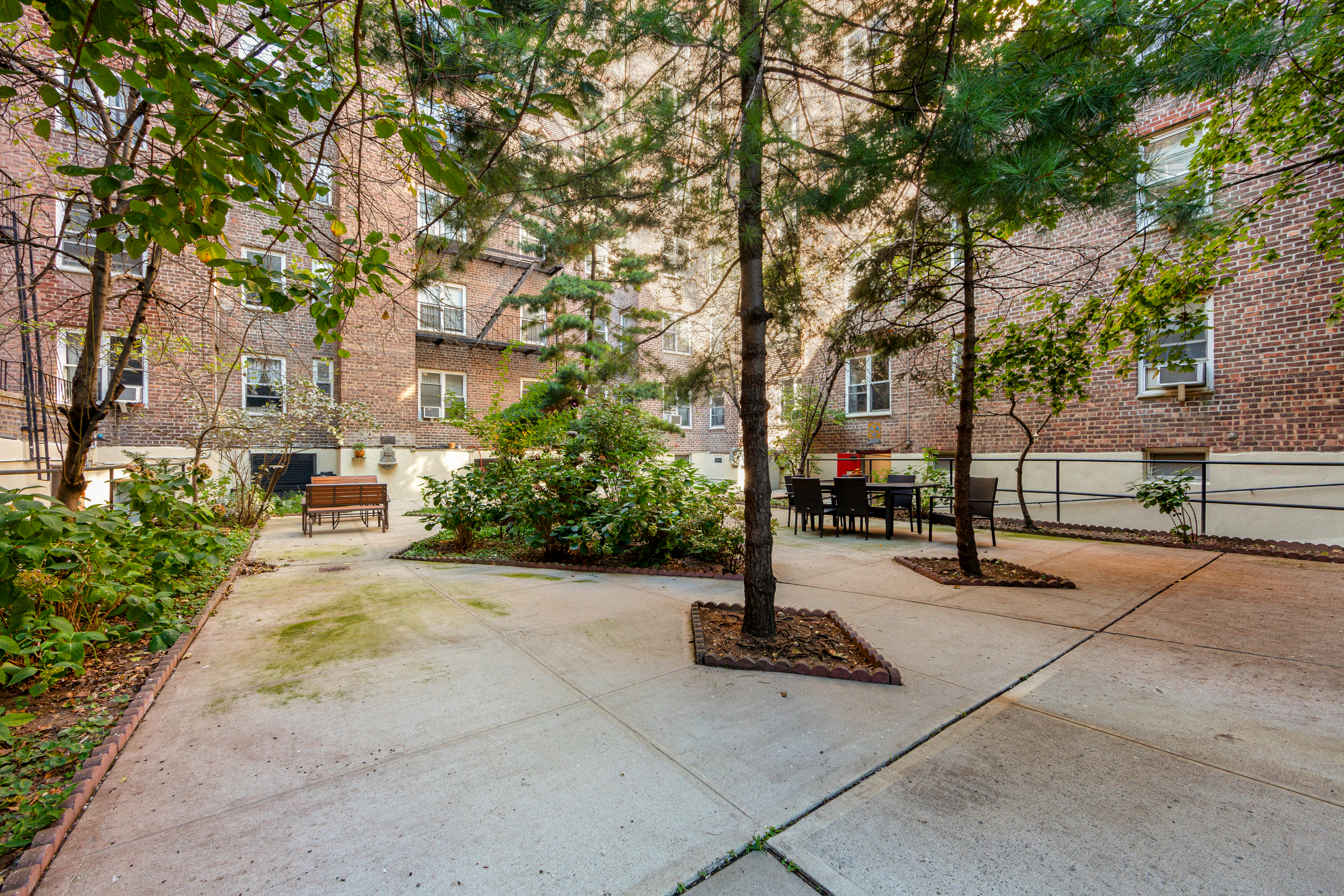 76-10 34th Avenue, Unit 2H Queens, NY 11372 - Photo 11 of 12 a view of a street with a tree