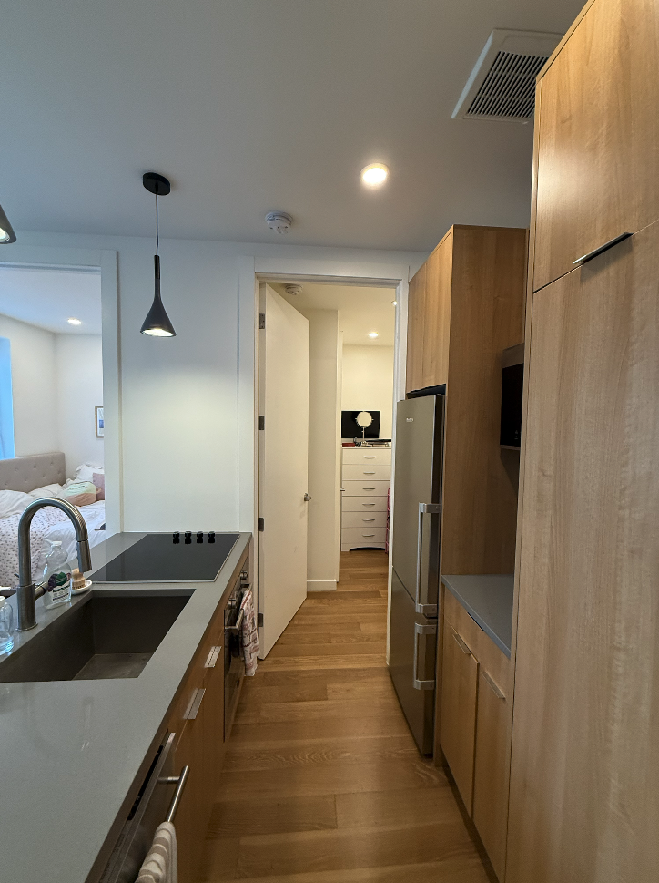 a kitchen with stainless steel appliances a refrigerator and a sink