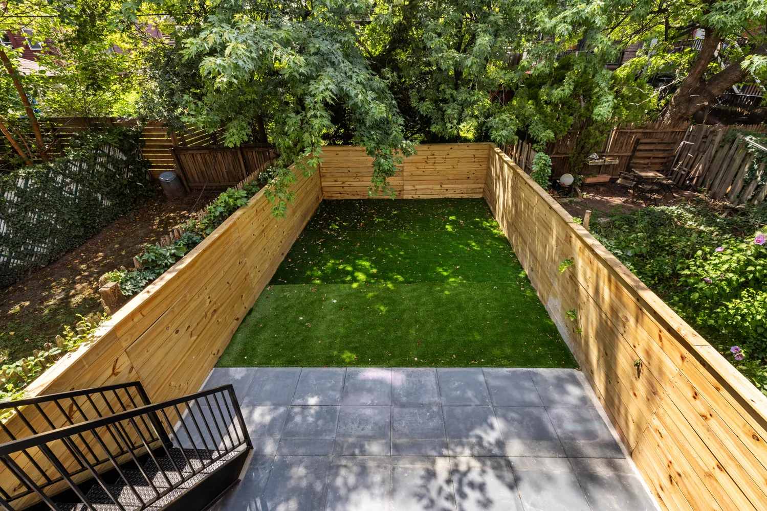 a view of a balcony with wooden floor