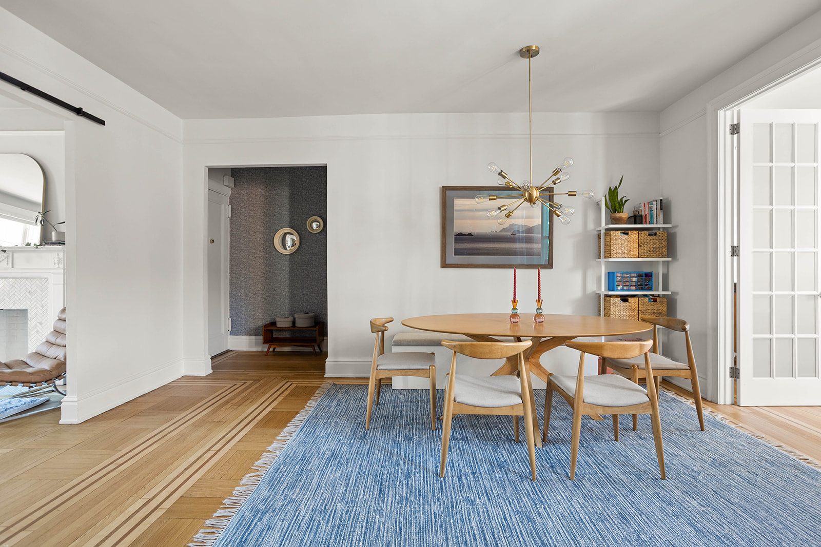 34-28 80th Street, Unit 41 Queens, NY 11372 - Photo 3 of 15 a dining room with wooden floor a glass table and chairs