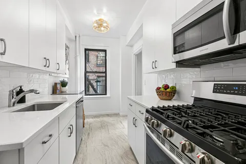 a kitchen with a stove and a sink