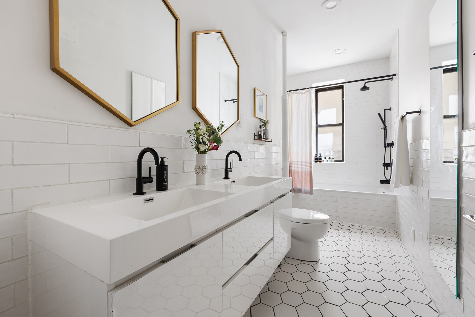 229 West 97th Street, Unit 5M New York, NY 10025 - Photo 7 of 11 a bathroom with a sink a toilet and a mirror