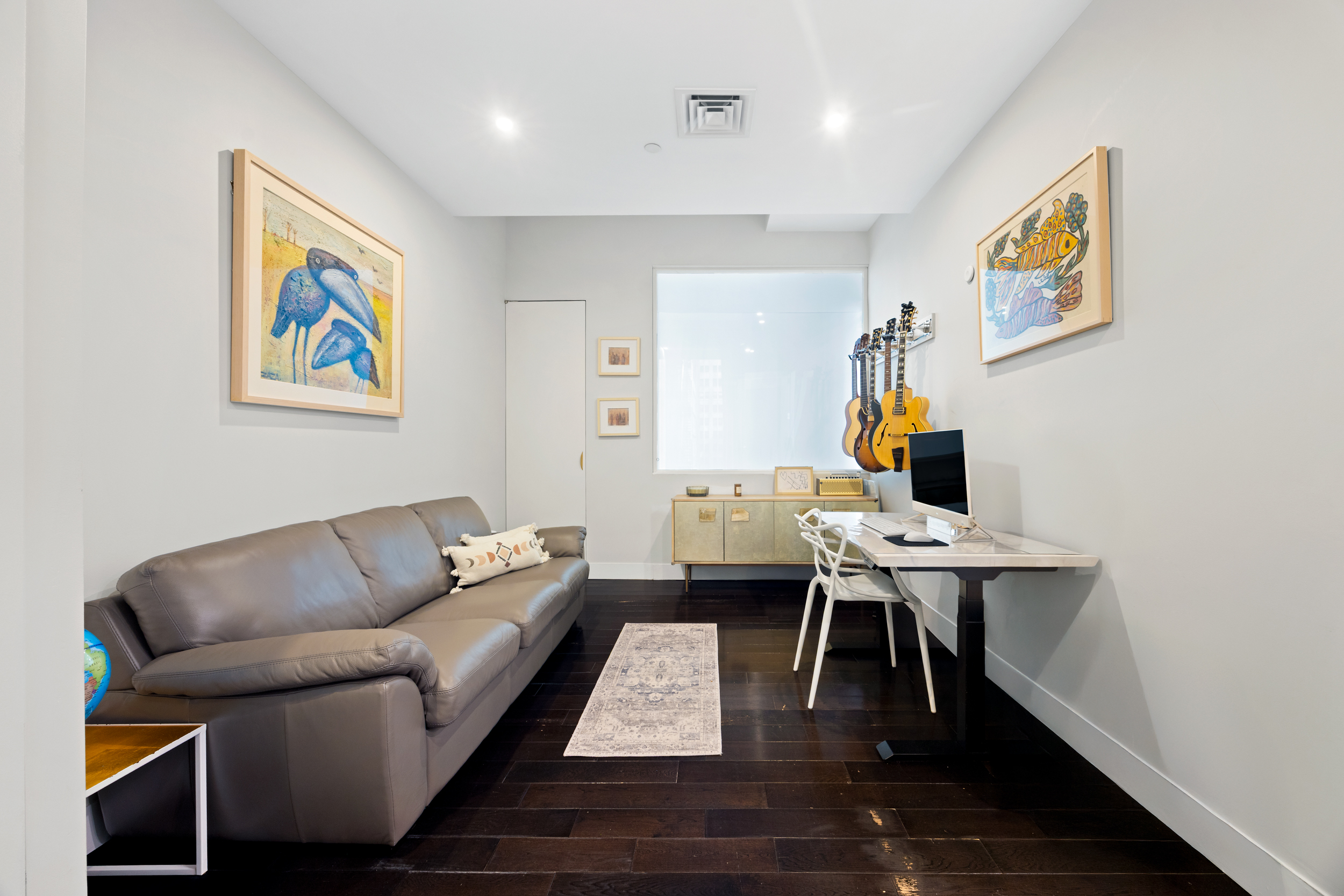 111 Fulton Street, Unit 824 Manhattan, NY 10038 - Photo 9 of 35 a living room with furniture and a wooden floor