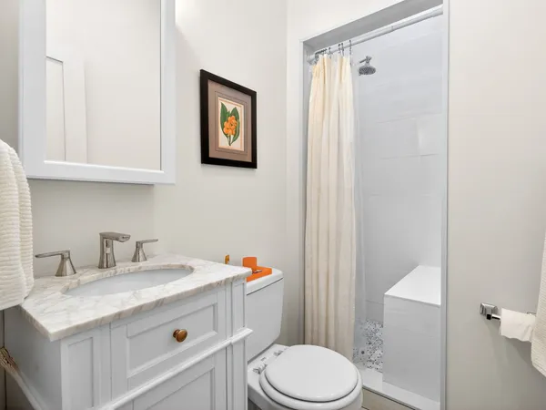 a bathroom with a sink toilet and vanity