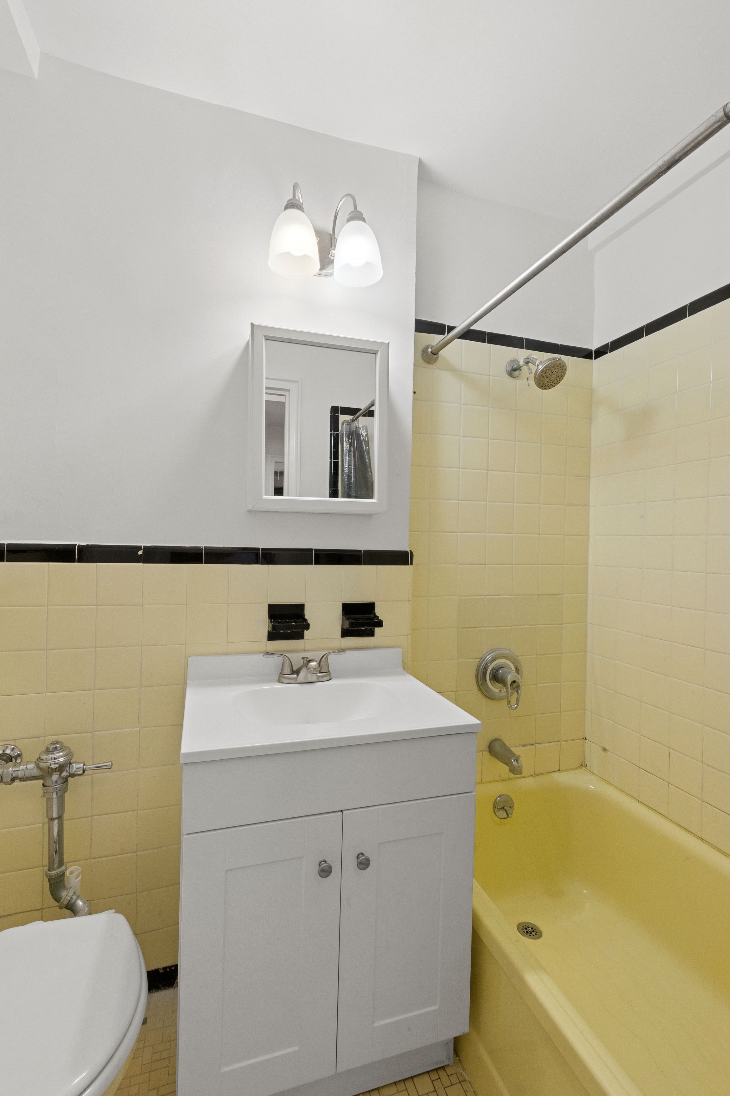 55 Park Terrace East, Unit B74 Manhattan, NY 10034 - Photo 16 of 26 a bathroom with a sink toilet and tub