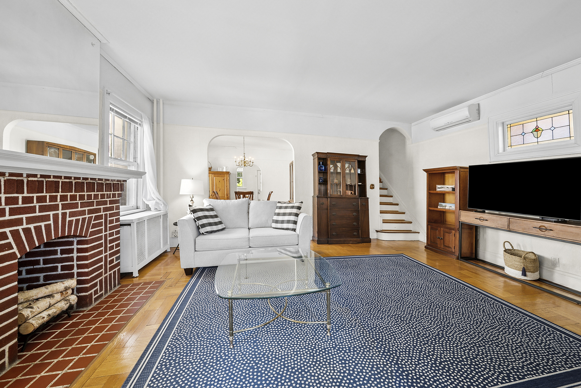 34-15 88th Street Queens, NY 11372 - Photo 3 of 15 a living room with furniture and a flat screen tv