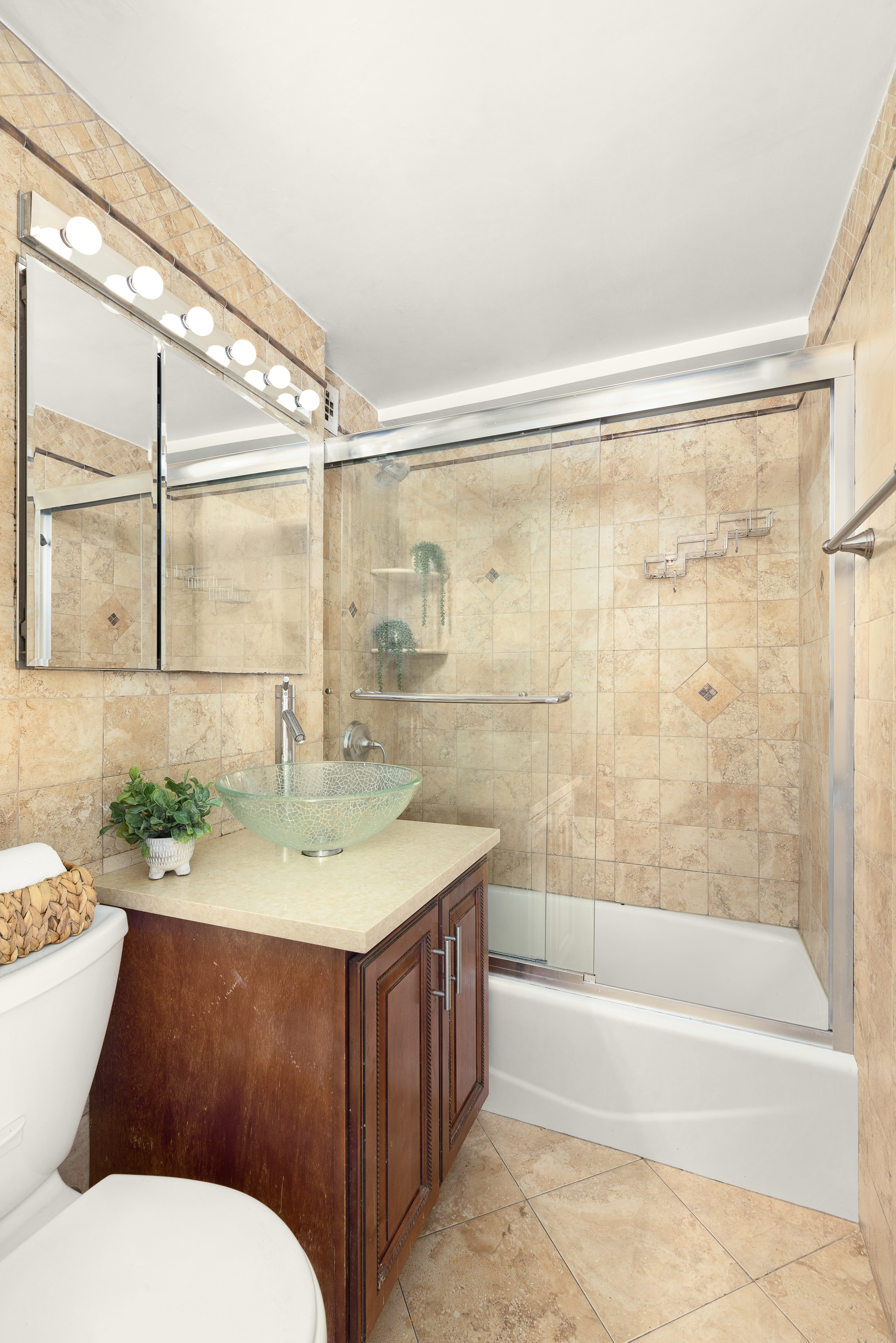 200 East 36th Street, Unit 2C Manhattan, NY 10016 - Photo 6 of 10 a bathroom with a sink a toilet and shower