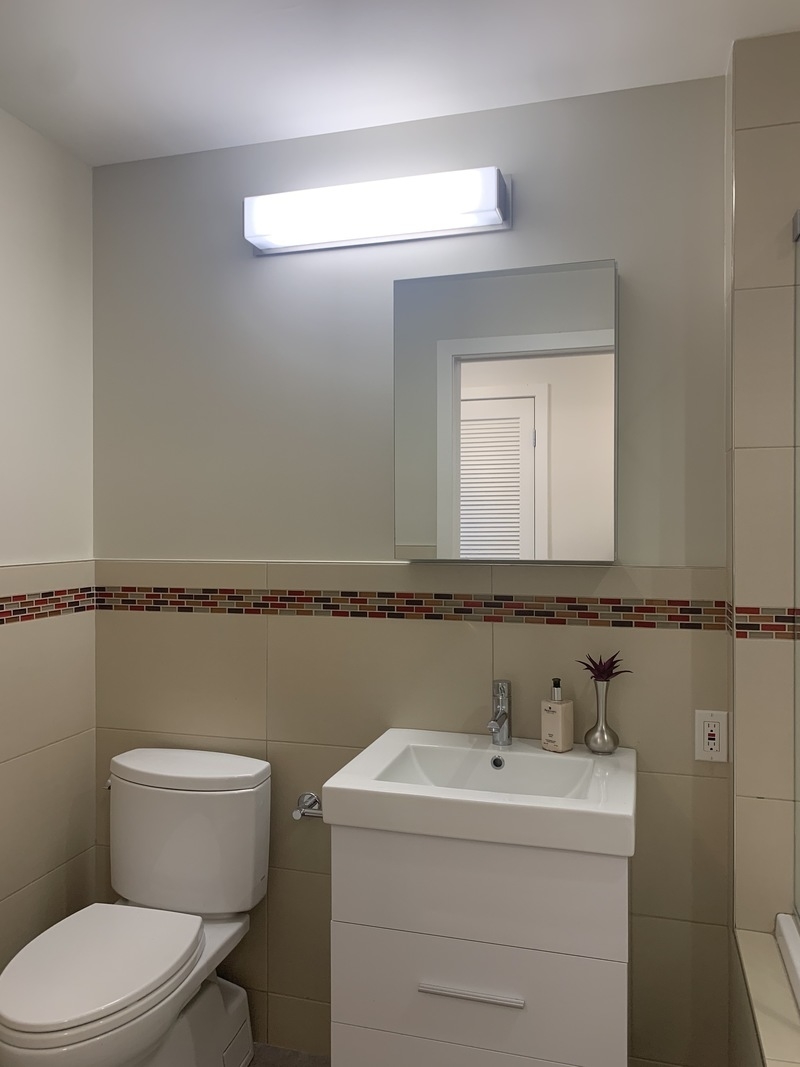 548 4th Avenue, Unit 4B Brooklyn, NY 11215 - Photo 16 of 22 a bathroom with a toilet sink and mirror