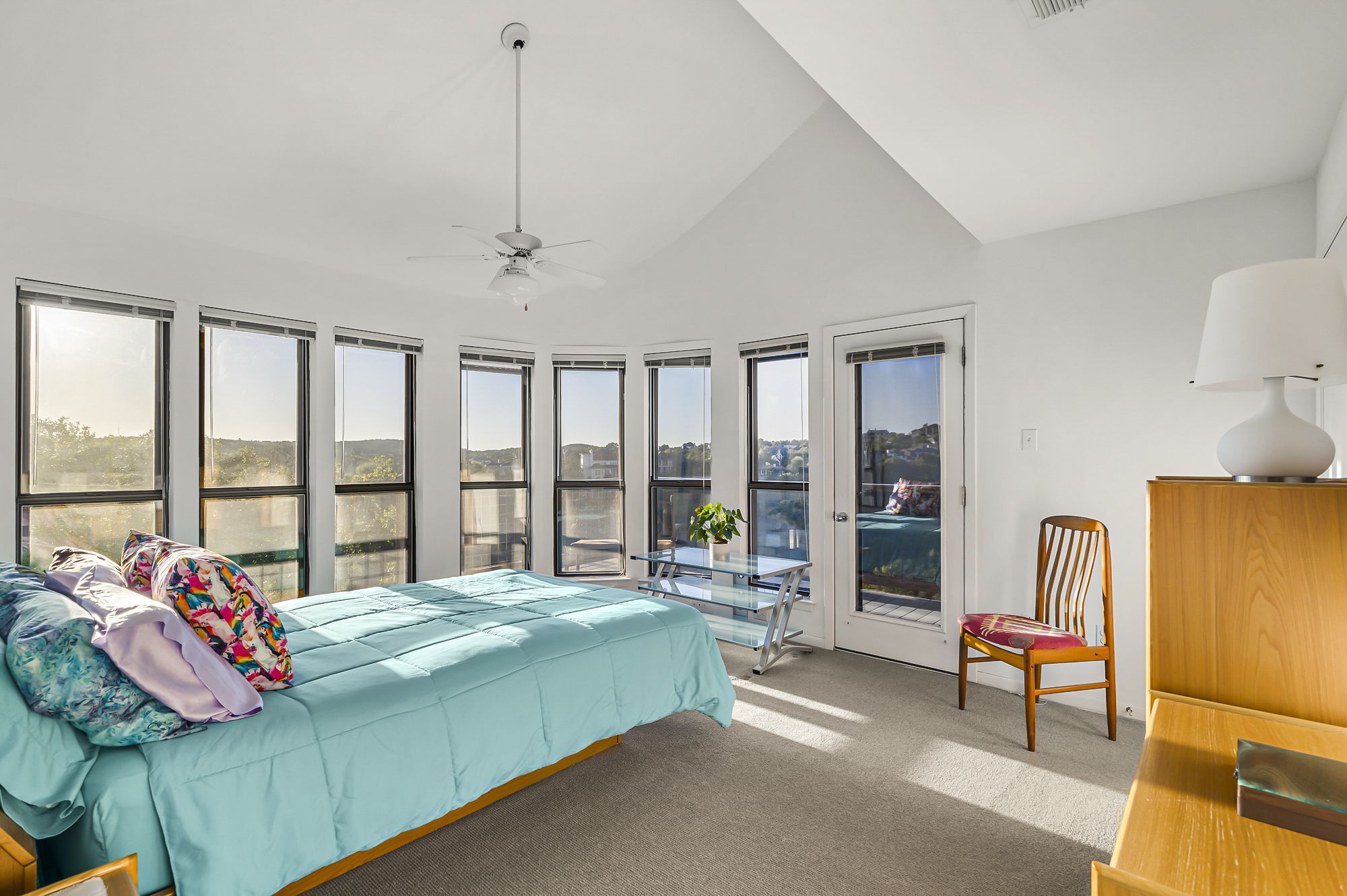 1605 The High Road Austin, TX 78746 - Photo 23 of 45 a bedroom with a bed and a large window