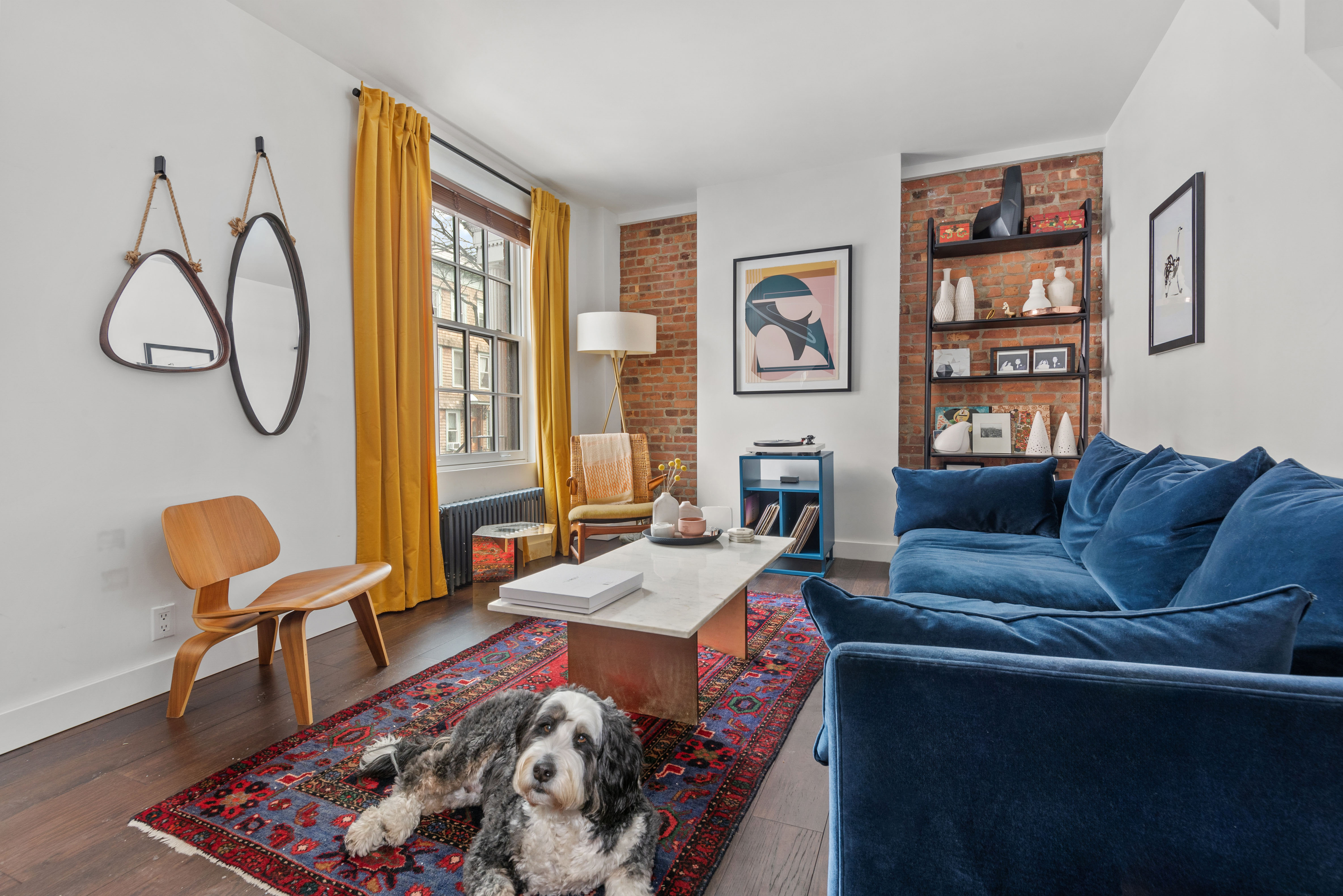 110 North 9th Street, Unit TH1 Brooklyn, NY 11249 - Photo 3 of 14 a living room with furniture and a window