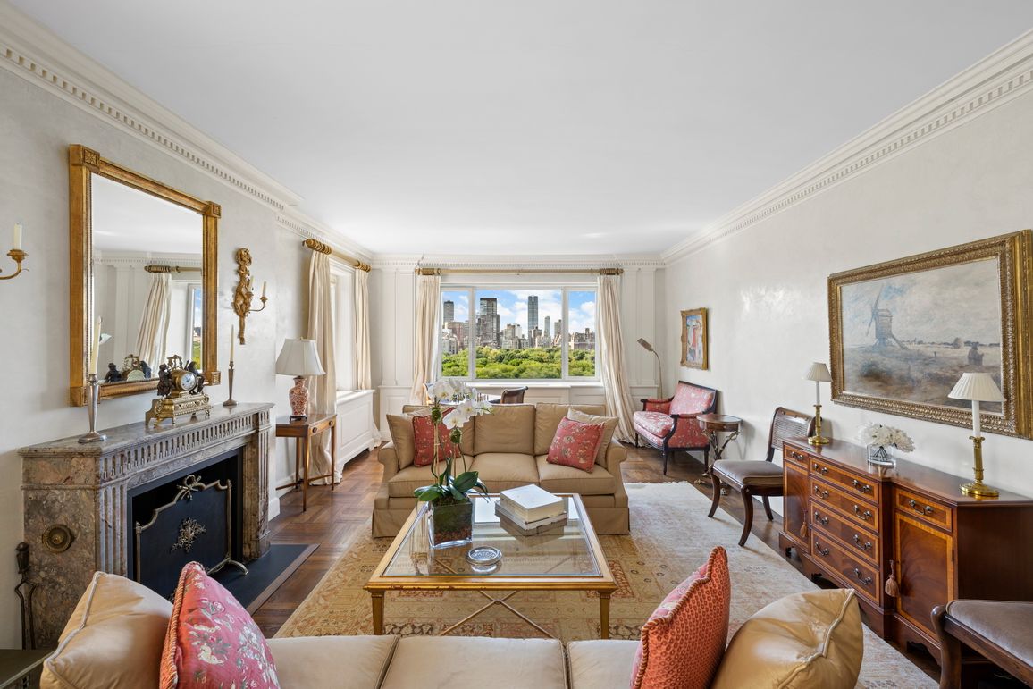 a living room with furniture large window and a flat screen tv