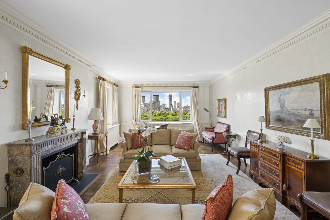 875 5th Avenue, Unit 18A Manhattan, NY 10065 - Photo 3 of 14 a living room with furniture large window and a flat screen tv