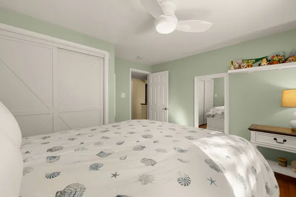 a view of a chair and table in the backyard