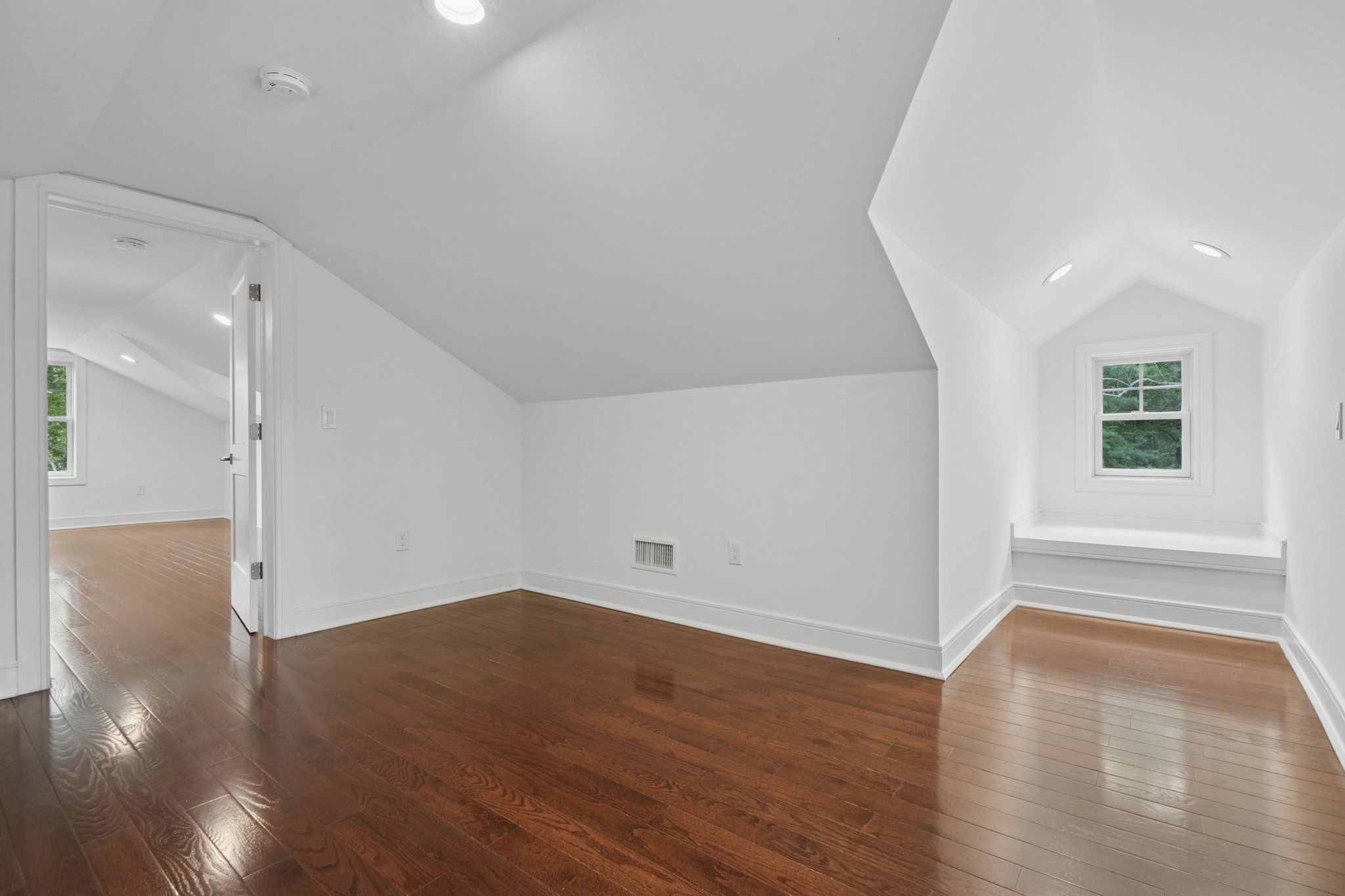 823 River Road Chatham, NJ 07928 - Photo 39 of 60 an empty room with wooden floor and windows