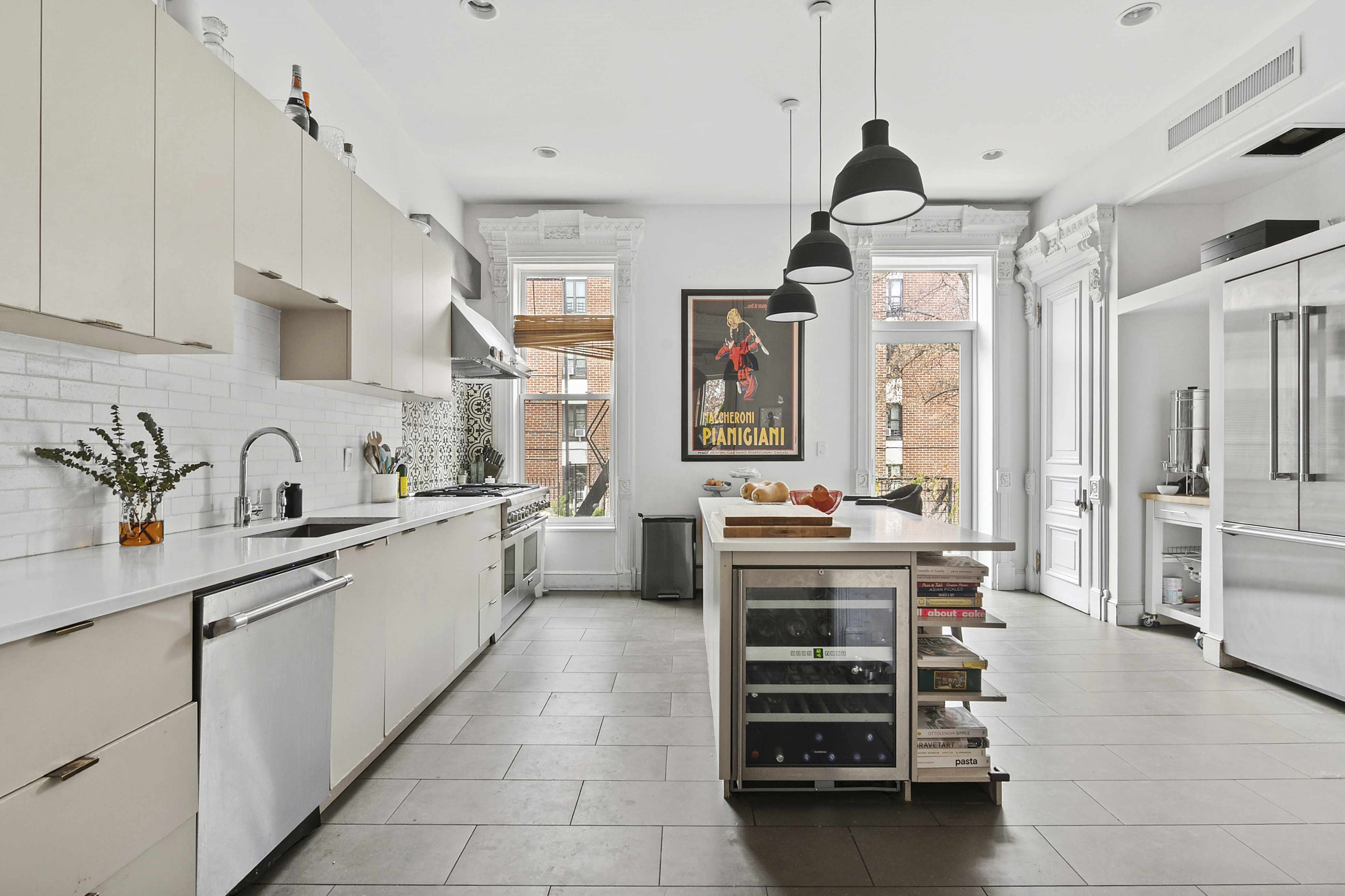 581 Greene Avenue, Unit 2 Brooklyn, NY 11216 - Photo 2 of 16 a kitchen that has a lot of cabinets in it and wooden floor