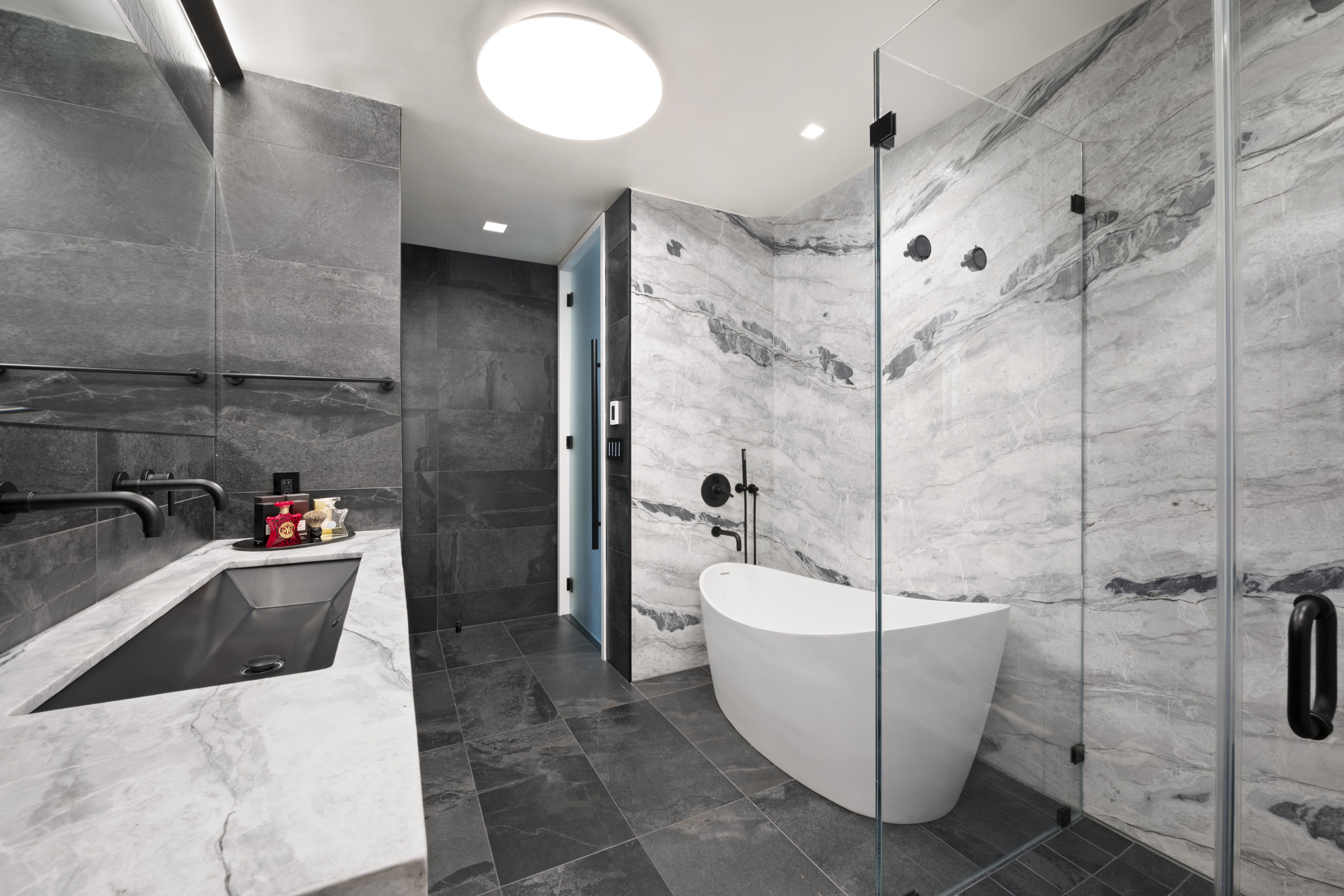 400 East 67th Street, Unit 19D Manhattan, NY 10065 - Photo 5 of 9 a bathroom with a sink a toilet and shower