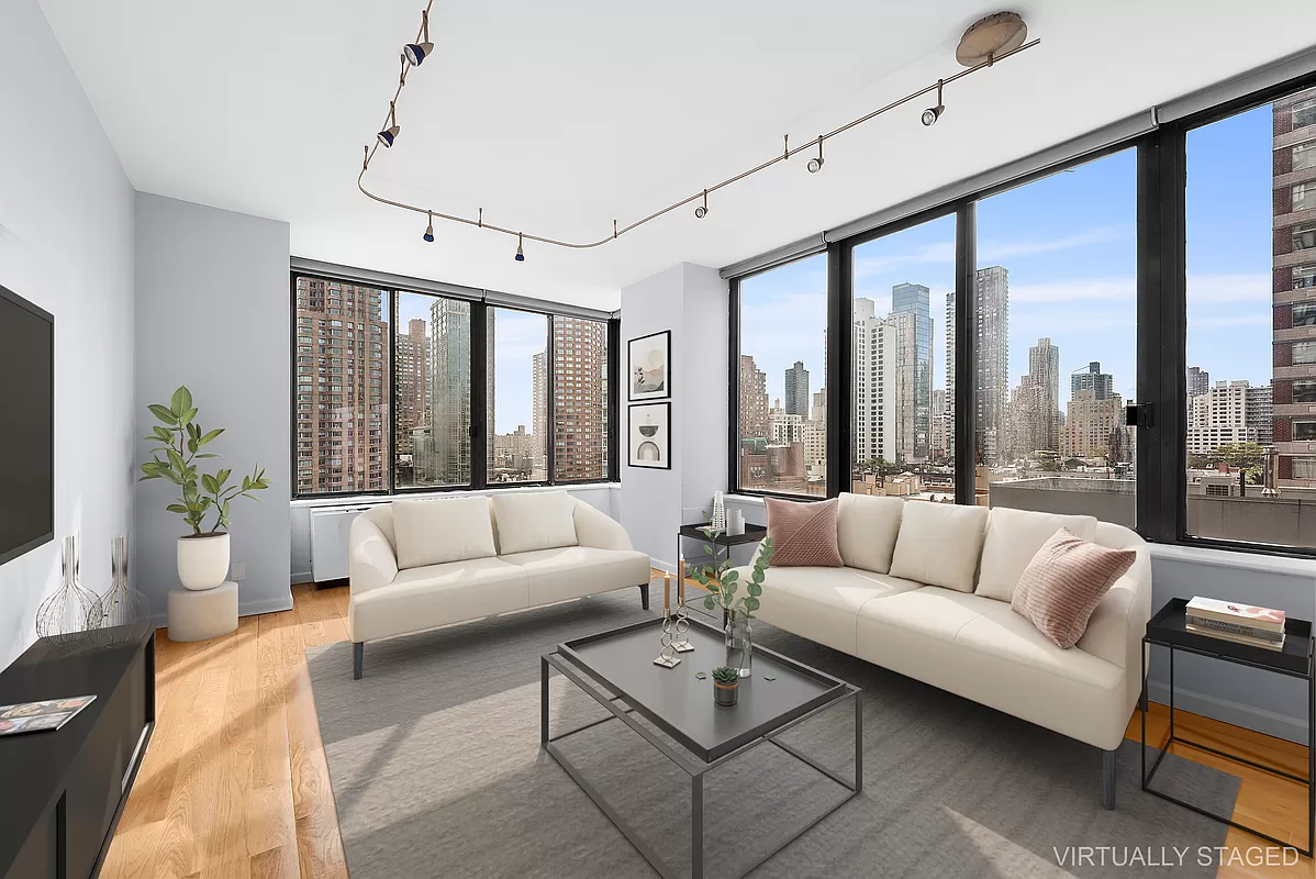300 East 93rd Street, Unit 14F Manhattan, NY 10128 - Photo 1 of 14 a living room with furniture and a large window