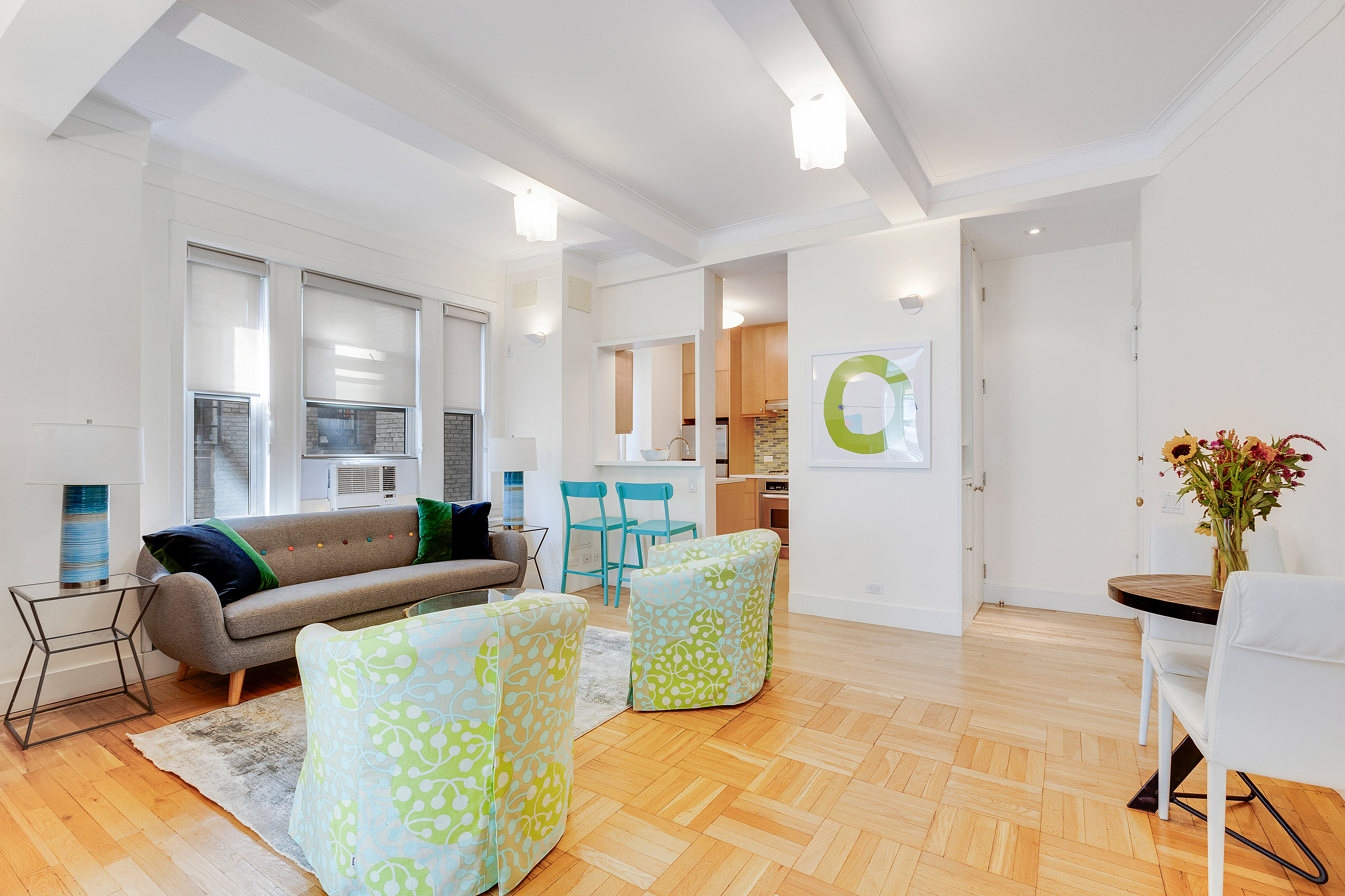 588 West End Avenue, Unit 6D Manhattan, NY 10024 - Photo 2 of 9 a living room with furniture and painting on the wall