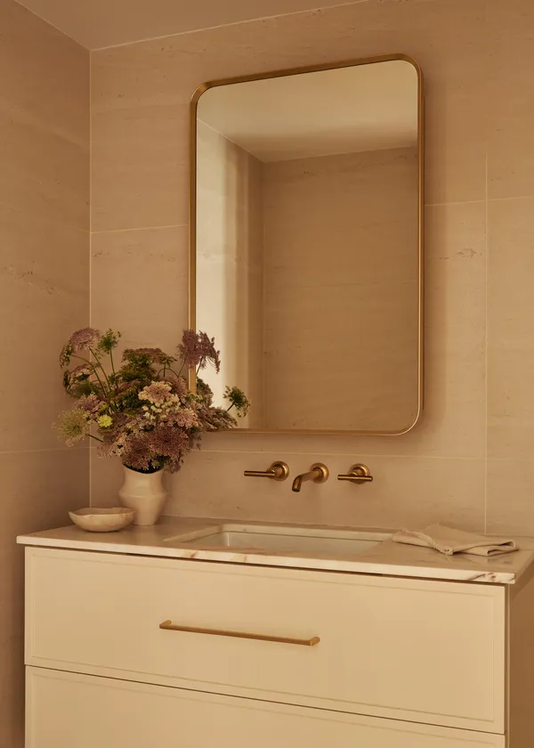 a bathroom with a sink and mirror