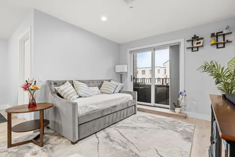 a bedroom with a bed and a table