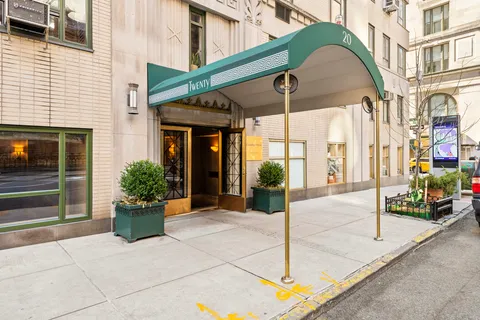 a view of a building with potted plants
