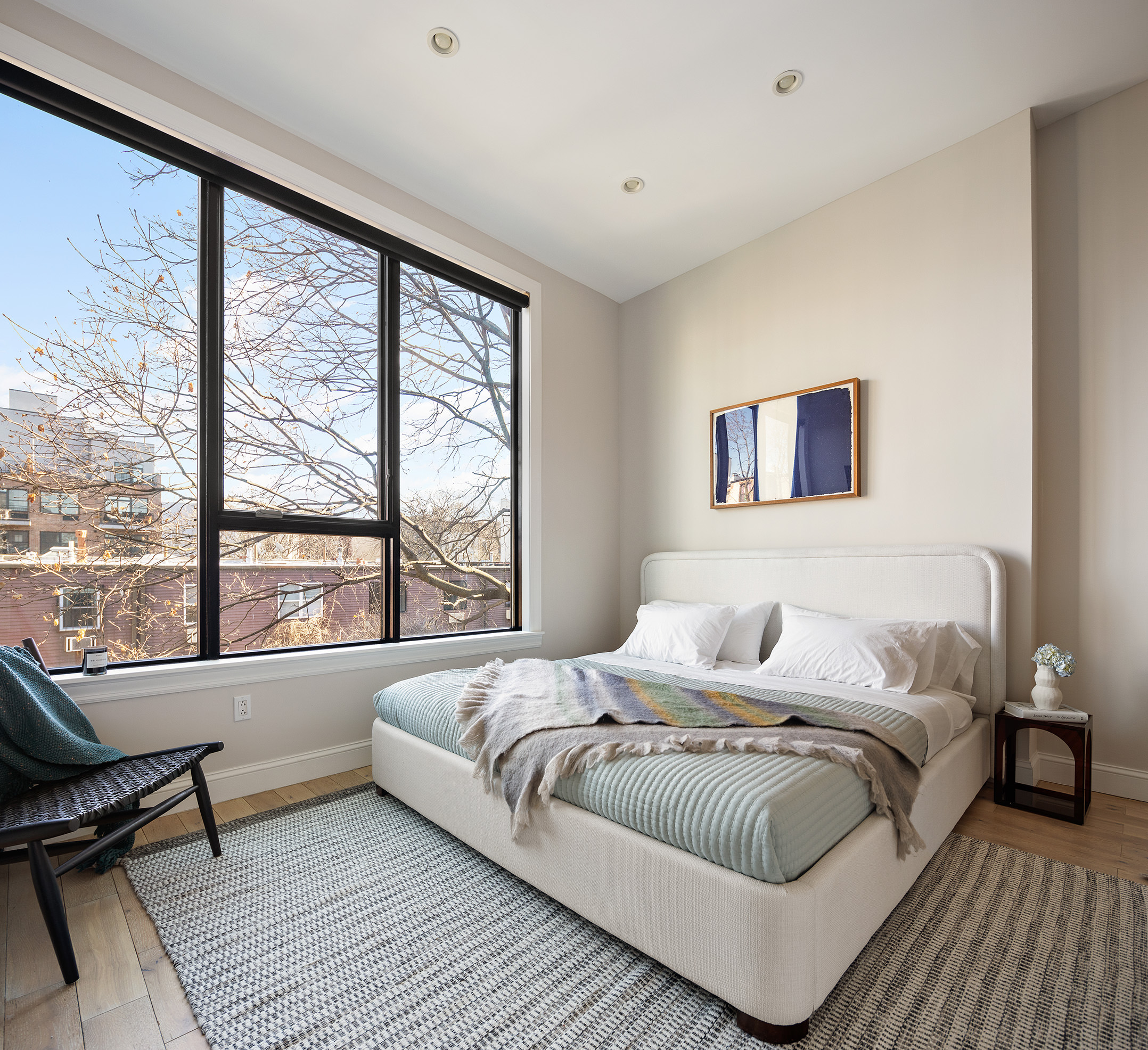 34 Woodbine Street Brooklyn, NY 11221 - Photo 6 of 15 a bedroom with a large bed and a large window