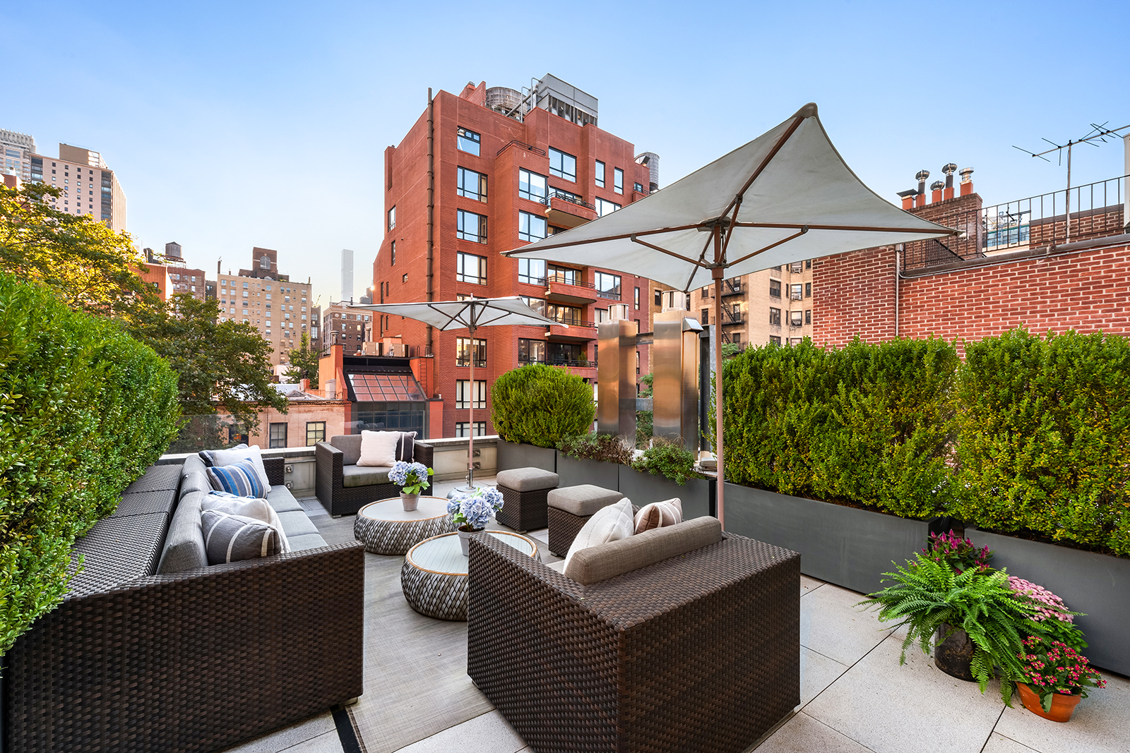 184 East 75th Street Manhattan, NY 10021 - Photo 16 of 20 a view of a patio with couches table and chairs and potted plants