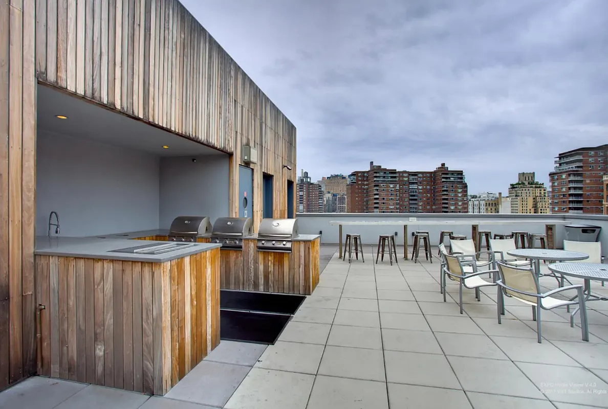 420 West 25th Street, Unit TH1E Manhattan, NY 10001 - Photo 20 of 22 a dinning table and chairs in front of a house