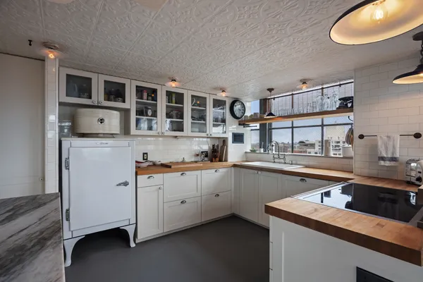 a kitchen that has a sink and cabinets