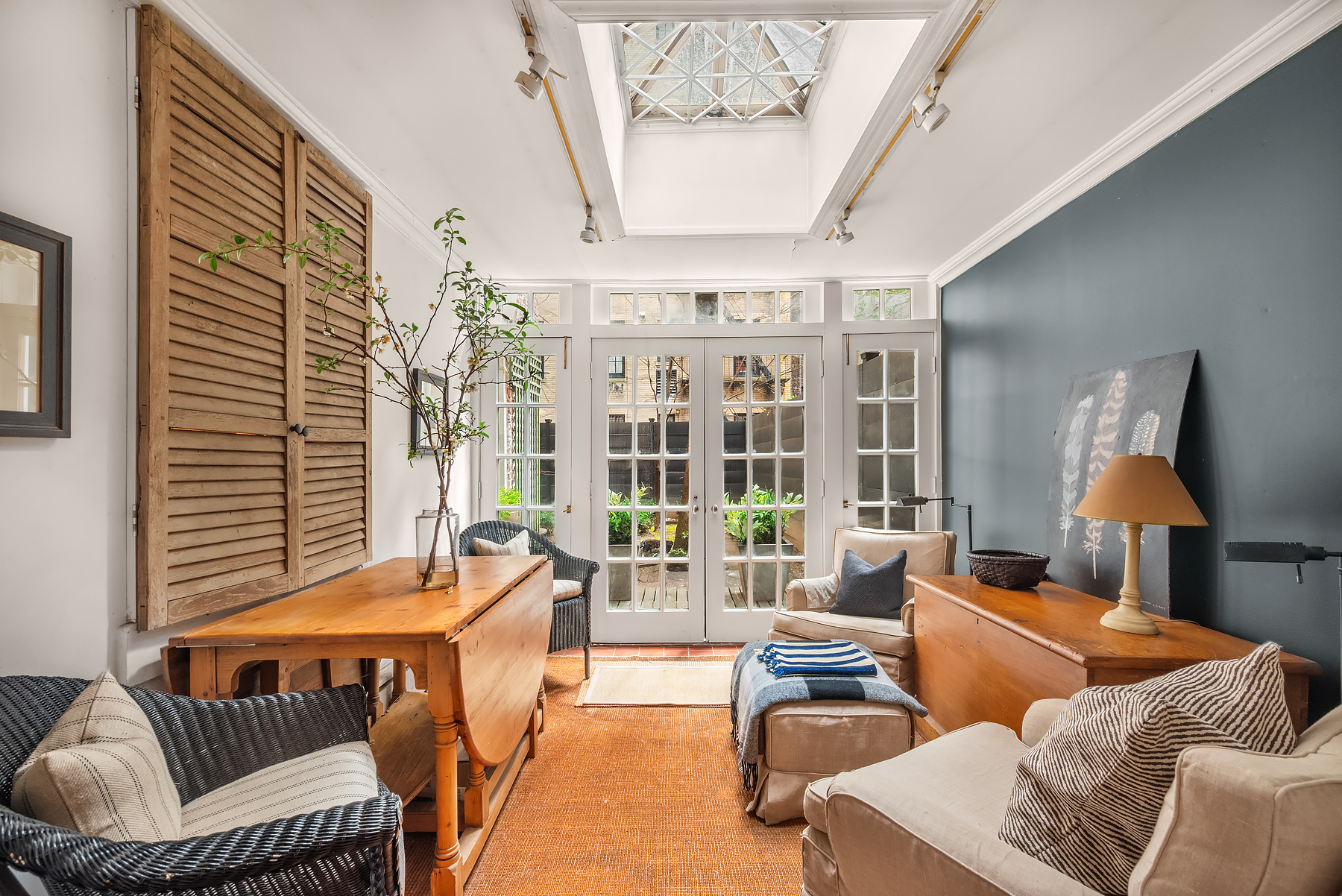 64 East 80th Street Manhattan, NY 10075 - Photo 4 of 14 a living room with furniture and a large window
