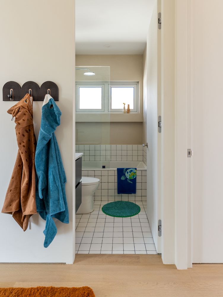 a view of a livingroom with wooden floor and a fireplace