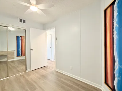 a view of a utility room with wooden floor