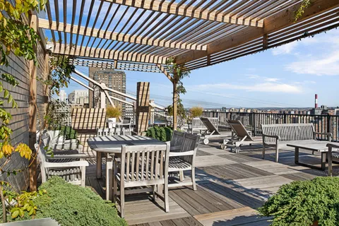 an outdoor sitting area with a table