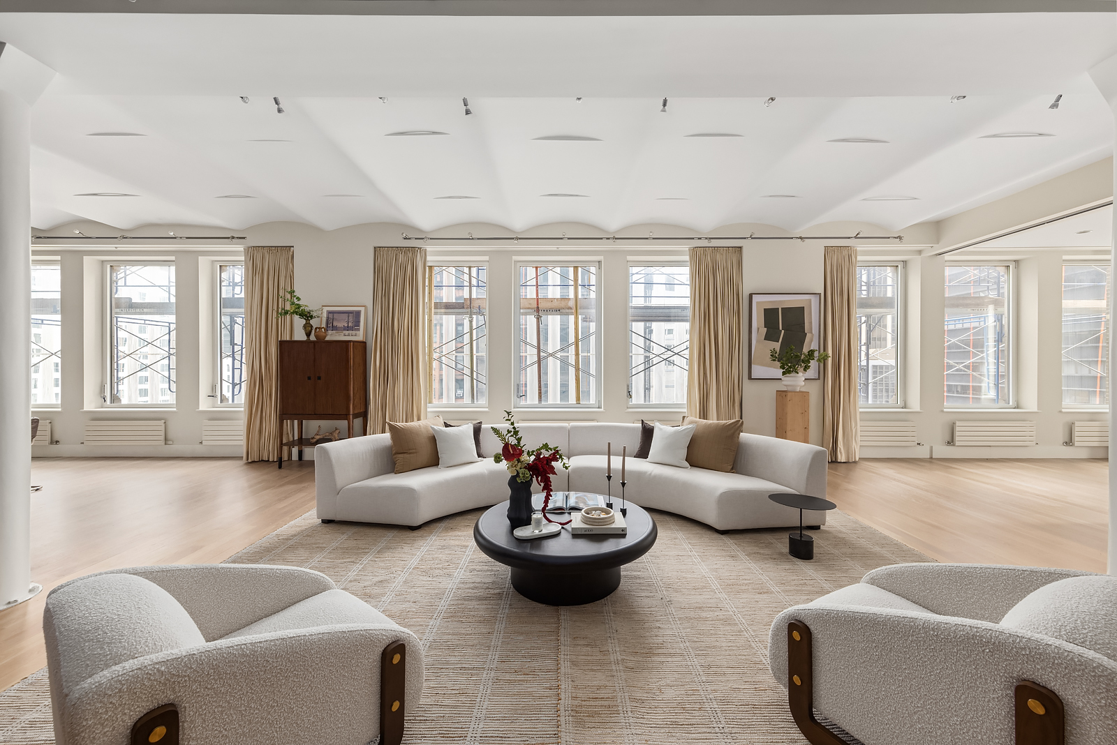 114 Liberty Street, Unit 7 Manhattan, NY 10006 - Photo 2 of 15 a living room with furniture and a large window
