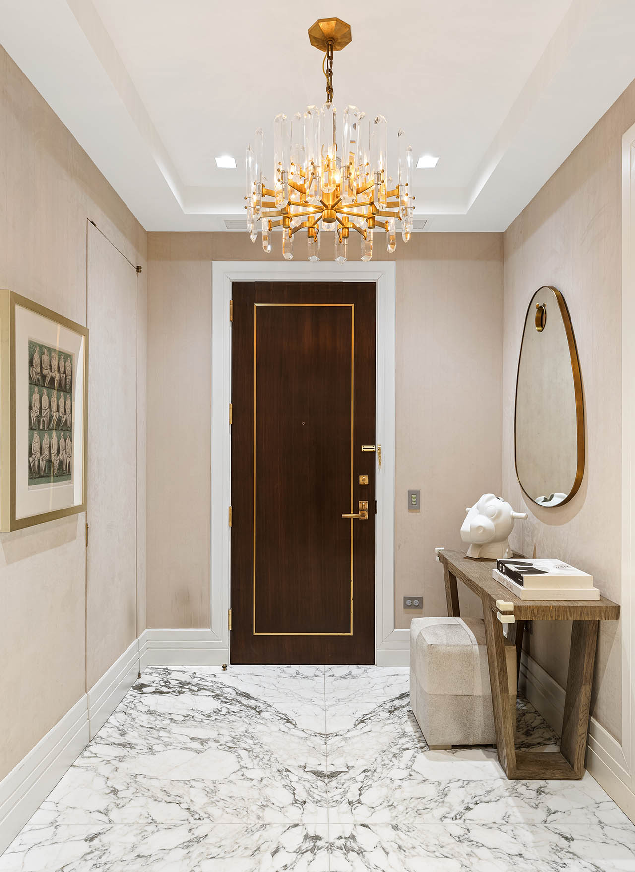 212 5th Avenue, Unit 9B Manhattan, NY 10010 - Photo 14 of 16 a room with a chandelier and wooden floor