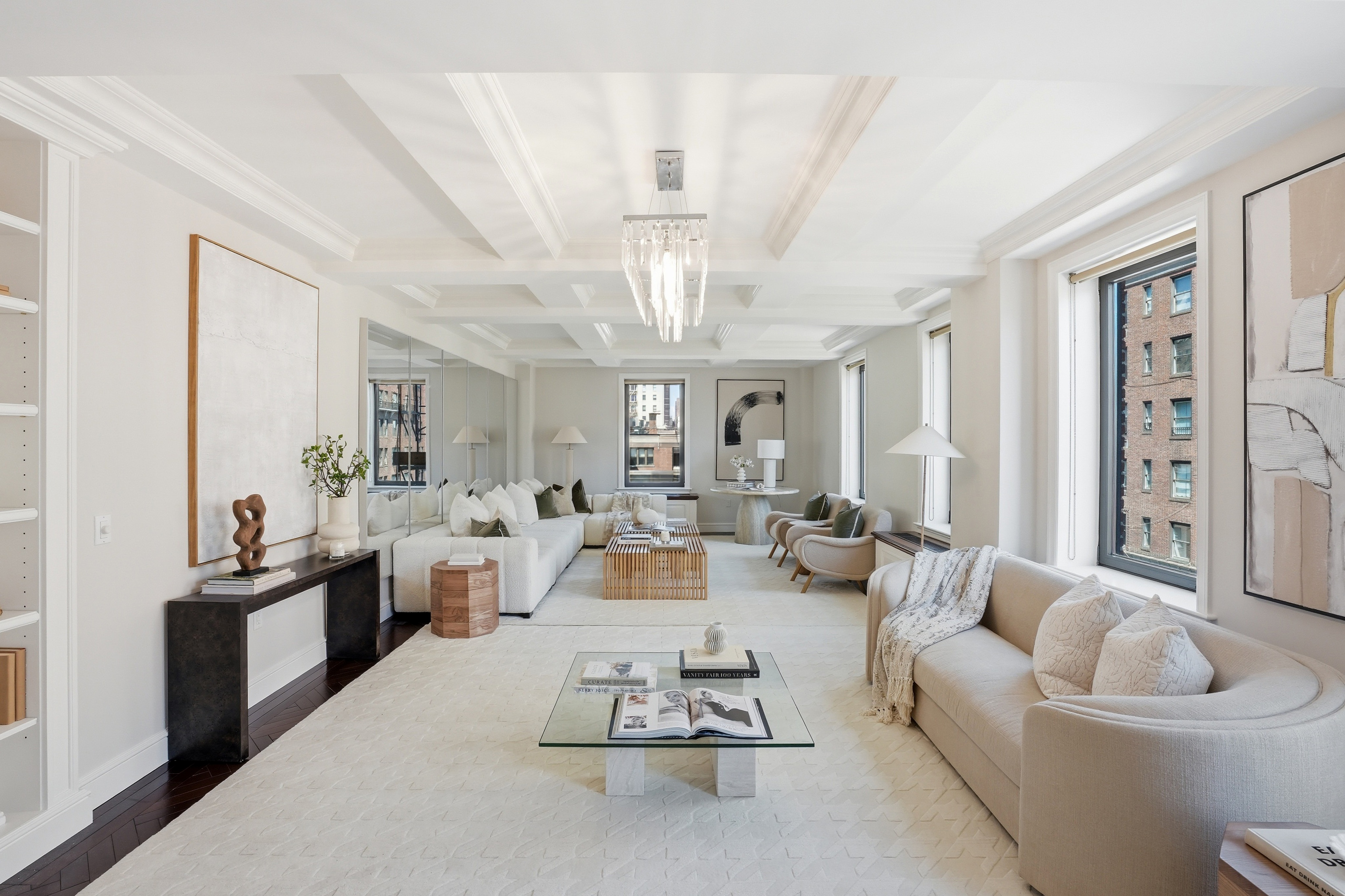 15 East 69th Street, Unit 7A Manhattan, NY 10021 - Photo 2 of 23 a living room with furniture and a chandelier