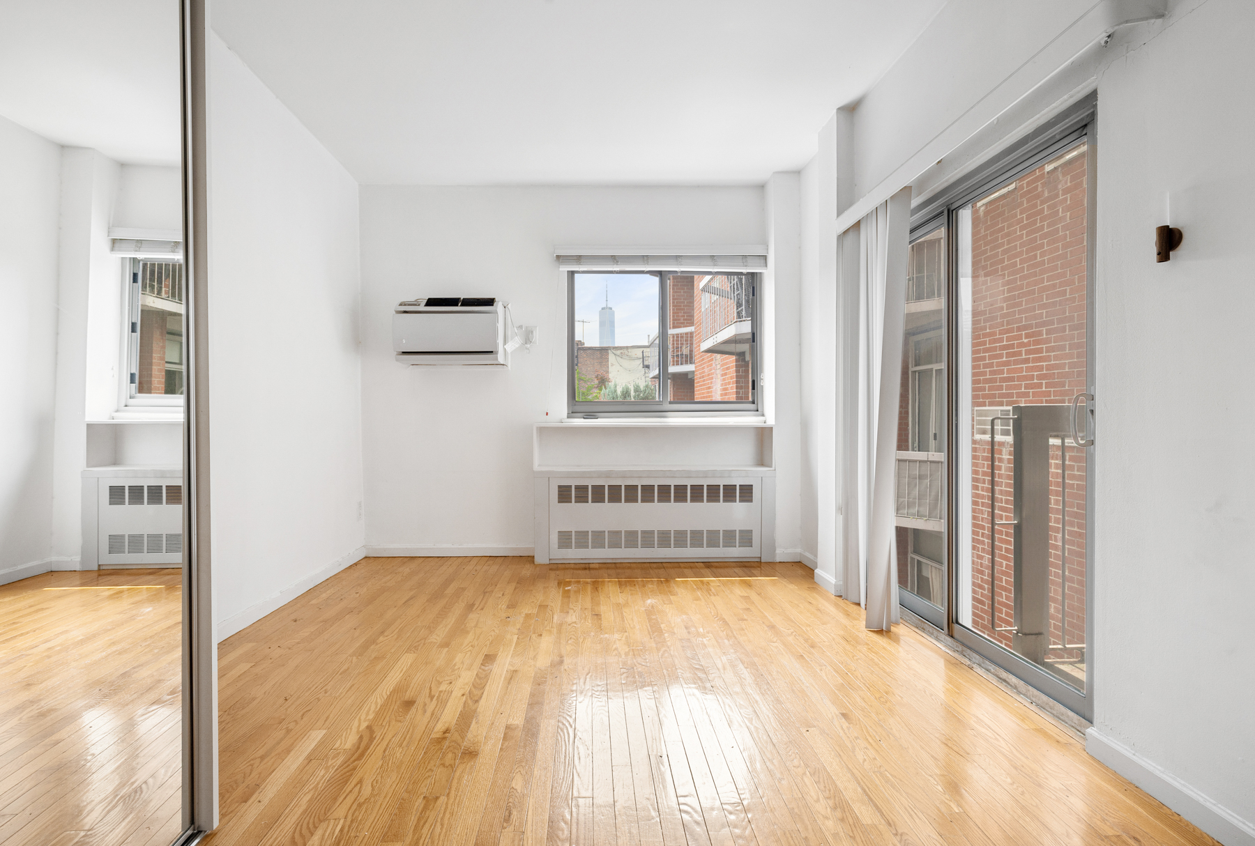 184 Thompson Street, Unit 4U Manhattan, NY 10012 - Photo 3 of 9 a view of an empty room with a window