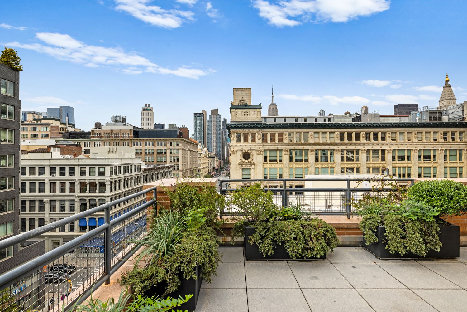 a view of balcony with potted plants